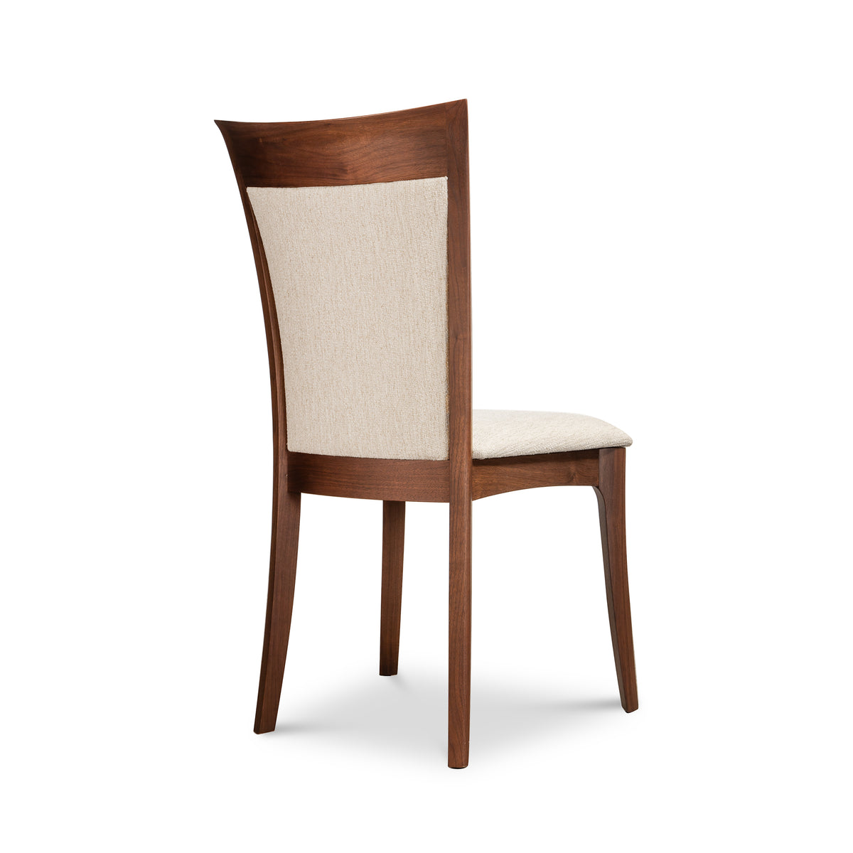 Morgan Shaker Chair by Copeland Furniture with beige upholstered backrest and seat, shown angled from behind to highlight craftsmanship.