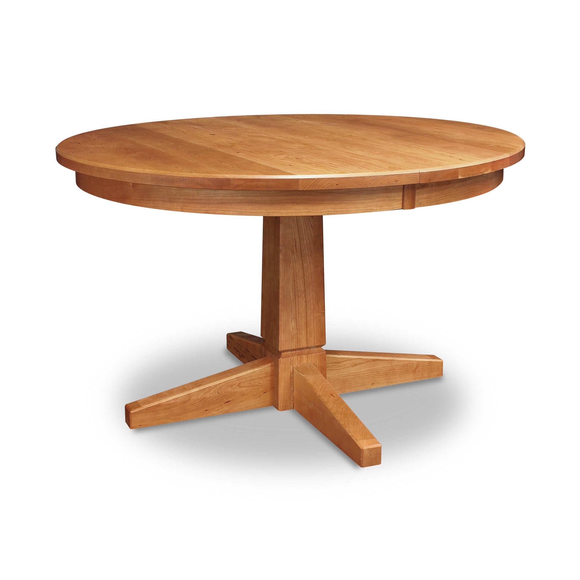 A Lyndon Furniture Natural Vermont Single Pedestal Round Extension Table with four legs on a white background.