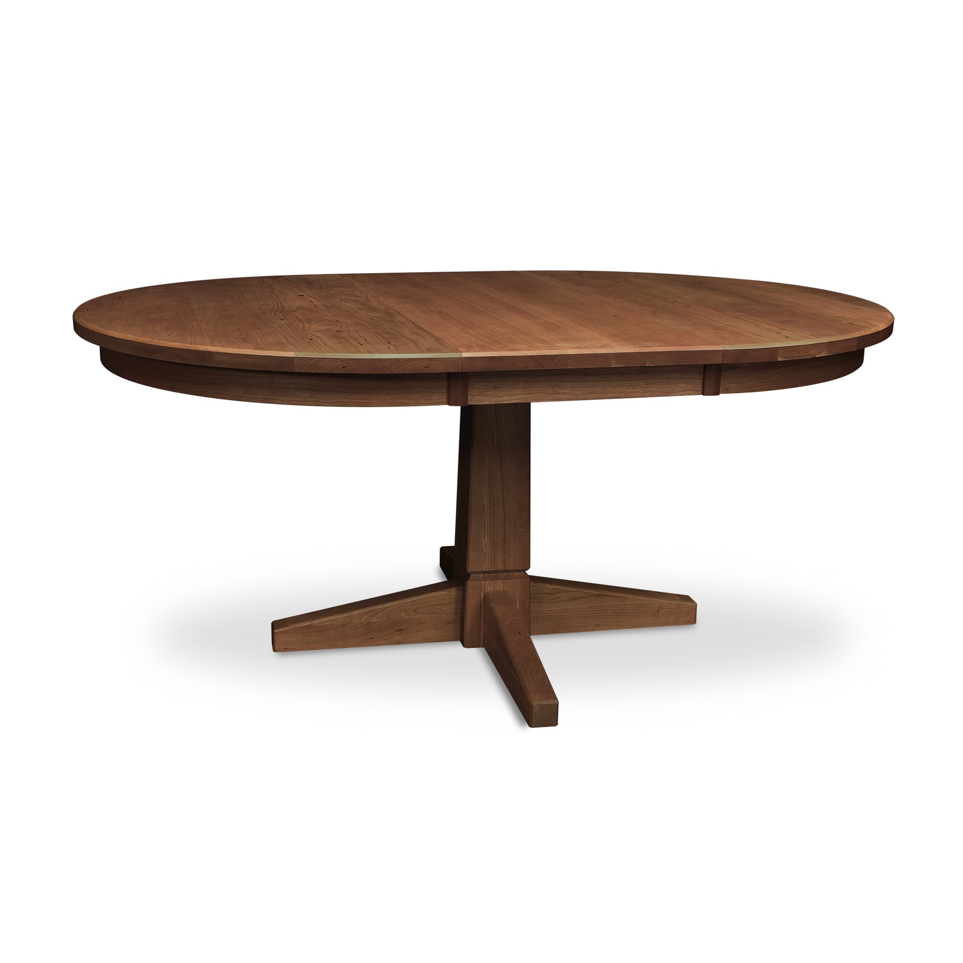 A round dining table with a Lyndon Furniture Natural Vermont Single Pedestal Round Extension Table, perfect for an eco-friendly dining room.
