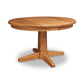 An eco-friendly Natural Vermont Single Pedestal Round Solid Top Table by Lyndon Furniture with four legs on a white background, perfect for an upscale kitchen.
