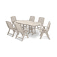 A beige POLYWOOD® Nautical 7-Piece Dining Set, consisting of a rectangular table and six matching folding chairs, arranged on a white background. The furniture is simplistic and modern in design.
