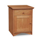 The Lyndon Furniture New England Shaker 1-Drawer Nightstand with Door and Arched Base is a small hardwood nightstand with a drawer, featuring the classic base style.