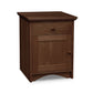 A hardwood New England Shaker 1-Drawer Nightstand with Door and Arched Base by Lyndon Furniture.