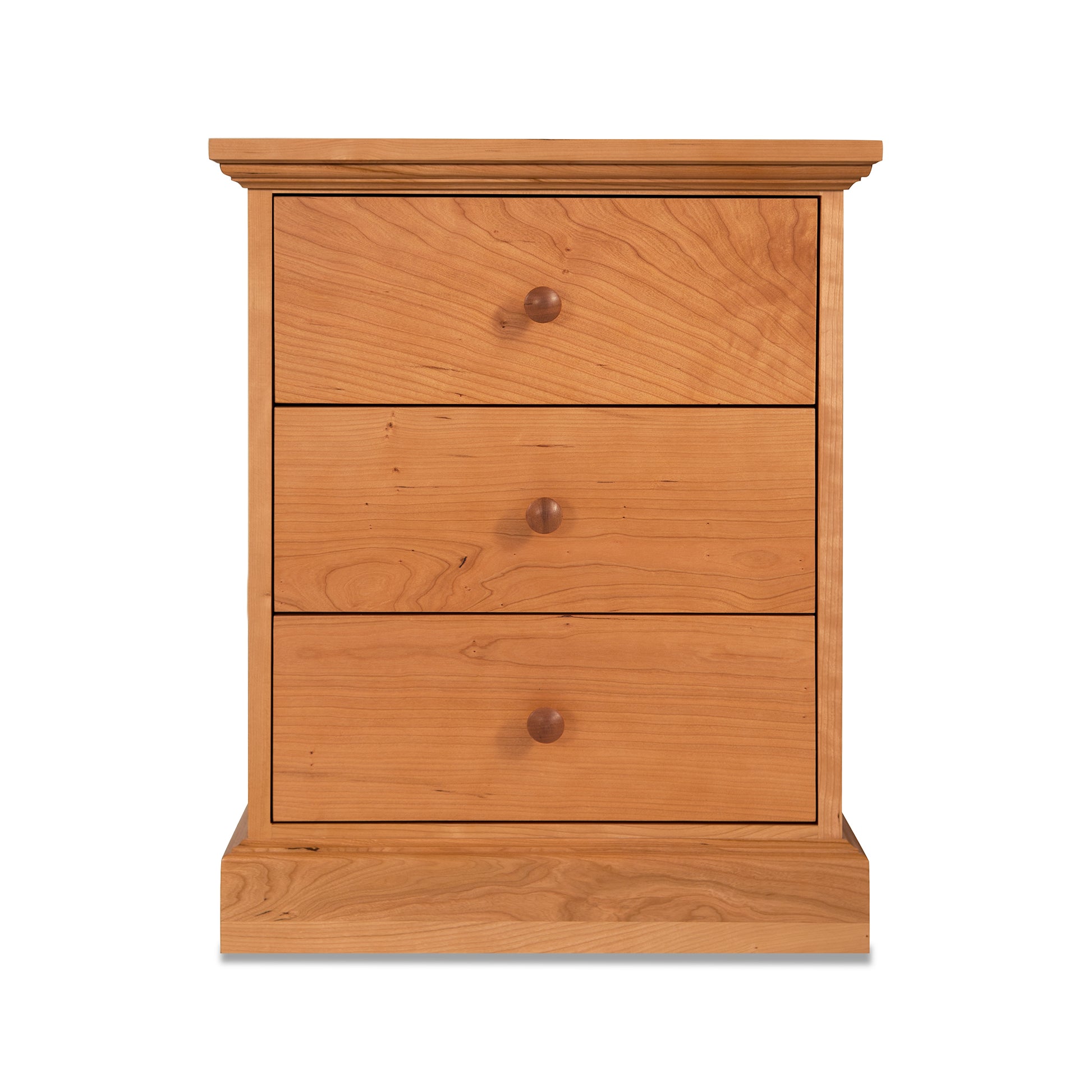 A New England Shaker 3-Drawer Nightstand by Lyndon Furniture with three drawers.