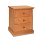 Lyndon Furniture New England Shaker 3-Drawer Nightstand in Solid Cherry Wood with Medium Brown Finish - Features Rectangular Top, Vertical Sides, Base with Small Overhang, and Matching Wooden Knobs for Easy Opening.