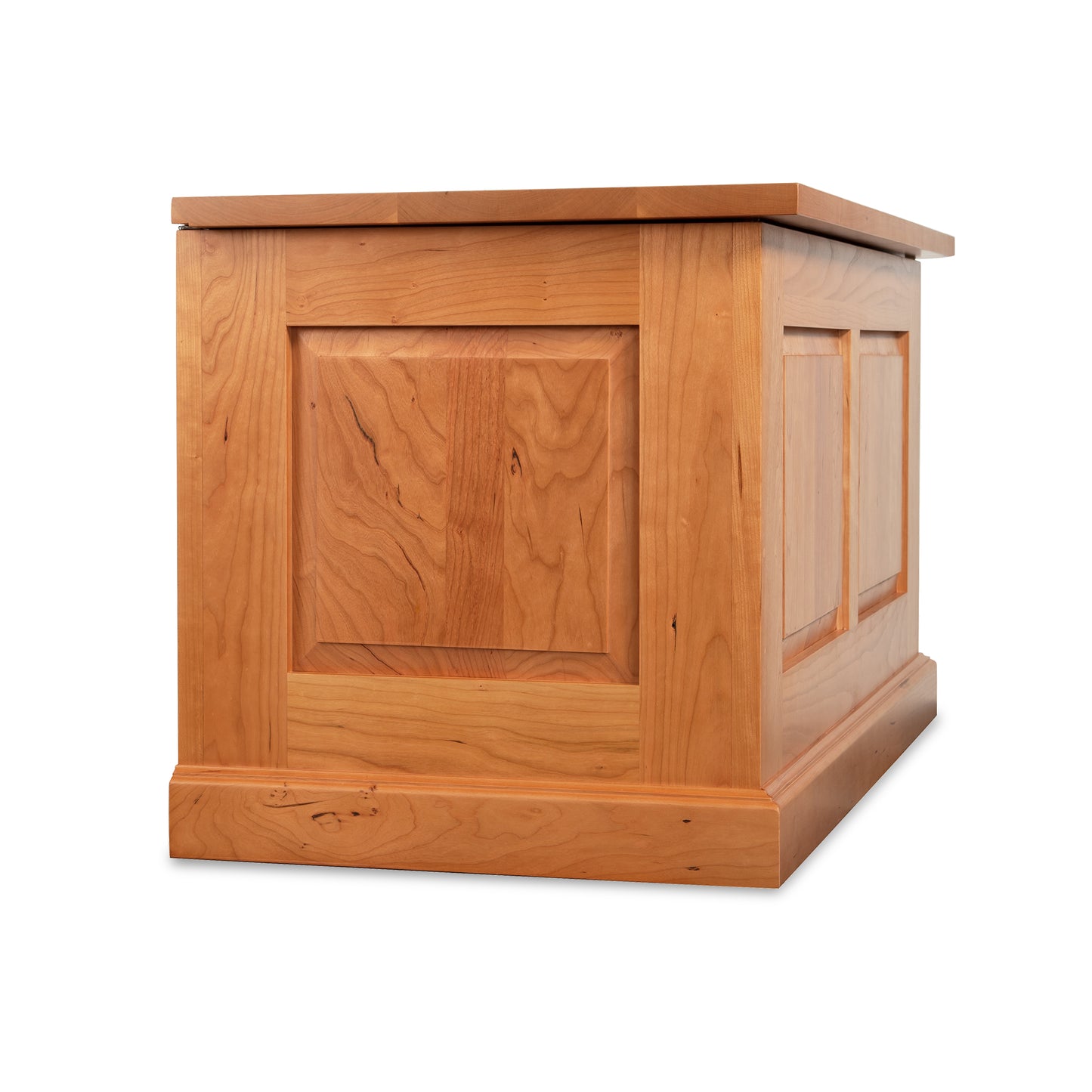 A sustainably harvested wooden box with a lid on it, made from North American hardwoods. This Lyndon Furniture New England Shaker Blanket Box is beautifully crafted and functional.