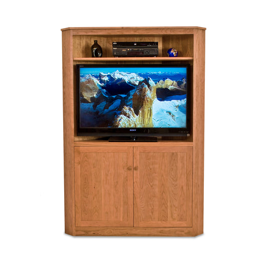 A New England Shaker Corner Entertainment Center from Lyndon Furniture, providing a media storage solution with a TV on top.