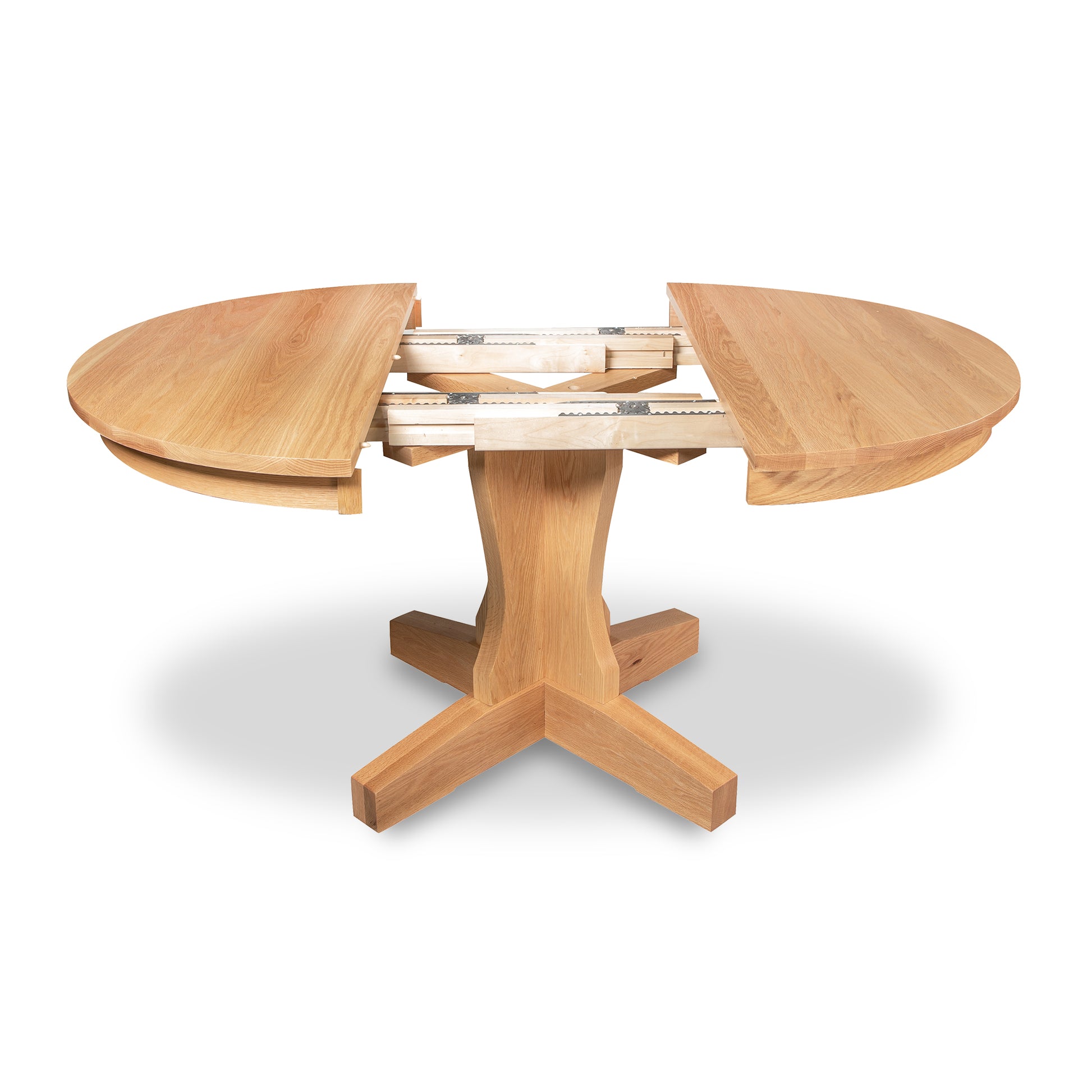 New Traditions Round Pedestal Extension Table by Lyndon Furniture, solid oak, four-legged pedestal base, expandable middle section, handcrafted in Vermont, USA.