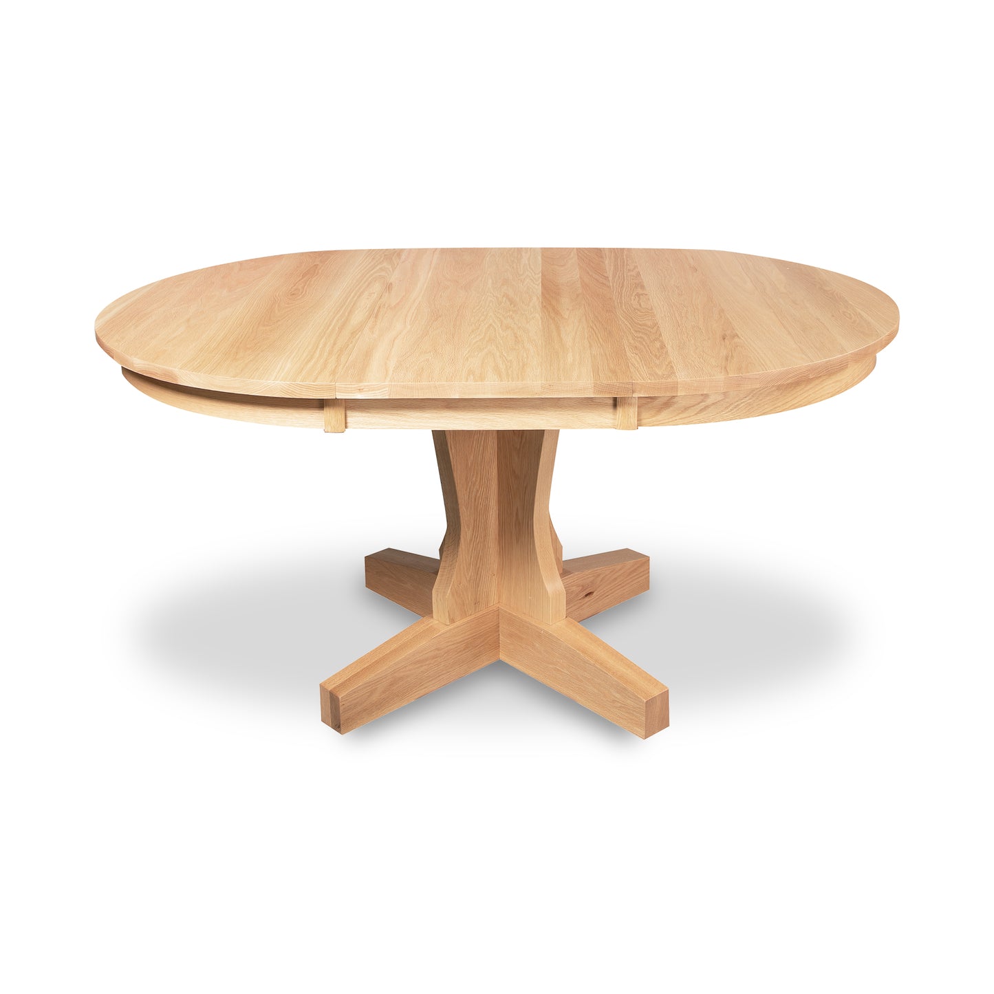 New Traditions Round Pedestal Extension Table by Lyndon Furniture in solid oak with a pedestal base and light finish, reflecting classic American Mission design. Now on clearance.