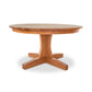 A New Traditions Round Pedestal Table from Lyndon Furniture, with a wooden base, crafted from hardwoods and featuring a natural finish.
