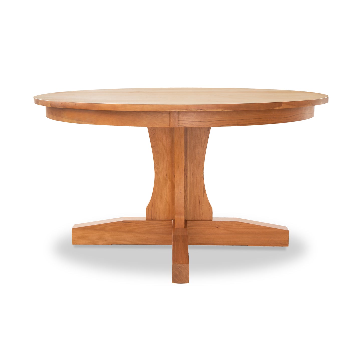 A Lyndon Furniture handmade New Traditions Round Pedestal Table with a wooden base and a natural finish.