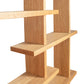 Lyndon Furniture's New York Contemporary Bookcase features modern intersecting shelves crafted from sustainably harvested wood, showcasing elegant design and craftsmanship.