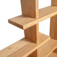 Lyndon Furniture New York Contemporary Bookcase showcasing intersecting panels and natural wood grain, crafted from sustainably sourced materials.