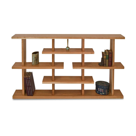 A New York Contemporary Step Bookcase with books on it by Lyndon Furniture.