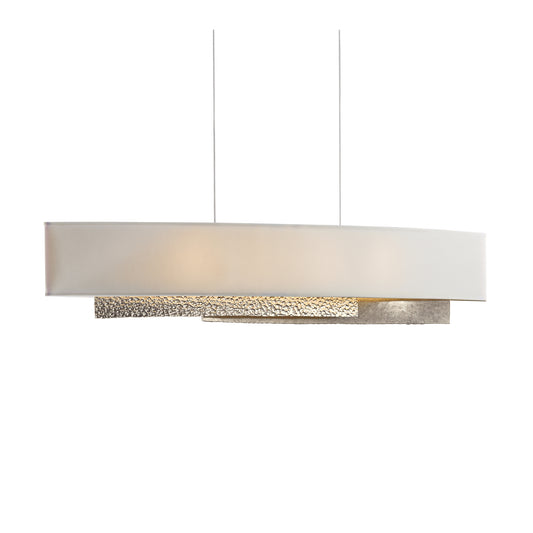 A modern Oceanus Pendant from Hubbardton Forge with a white shade.