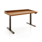 Copeland Furniture Odin Sit-Stand Desk with a solid wood top, raised edge, and black metal adjustable legs, showcasing fine American craftsmanship.