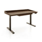 Odin Sit-Stand Desk by Copeland Furniture with rich brown wood, sturdy metal legs, ergonomic control panel, and a distinctive raised tabletop edge.