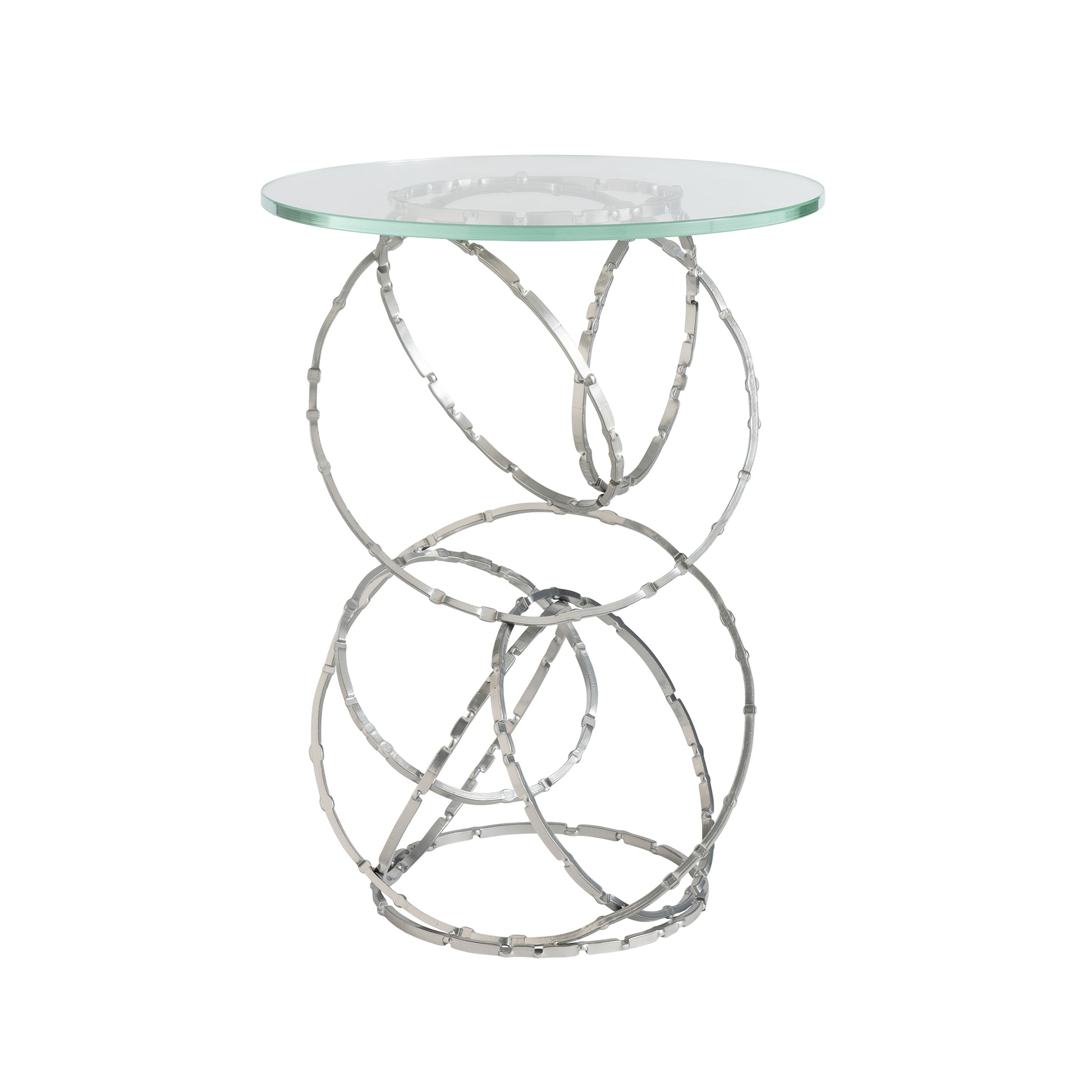 Introducing the Olympus Glass Top Accent Table by Hubbardton Forge, a stylish piece with a contemporary design. The base showcases intricately intertwined circular metal bands finished in sleek silver, forming an elegant open structure ideal for any modern home.