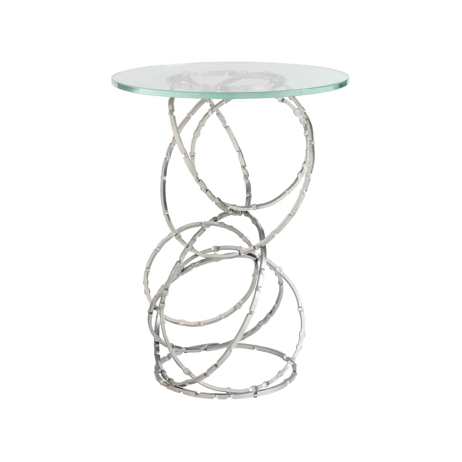 The Hubbardton Forge Olympus Glass Top Accent Table showcases a round glass surface paired with an intricate pedestal-style base composed of twisting, interlocking rings. Ideal for modern homes, its open design provides both a stylish and artistic look.