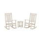 Two white POLYWOOD® Estate 3-Piece Rocking Chair Sets facing each other with a small round table between them, all placed on a white background.