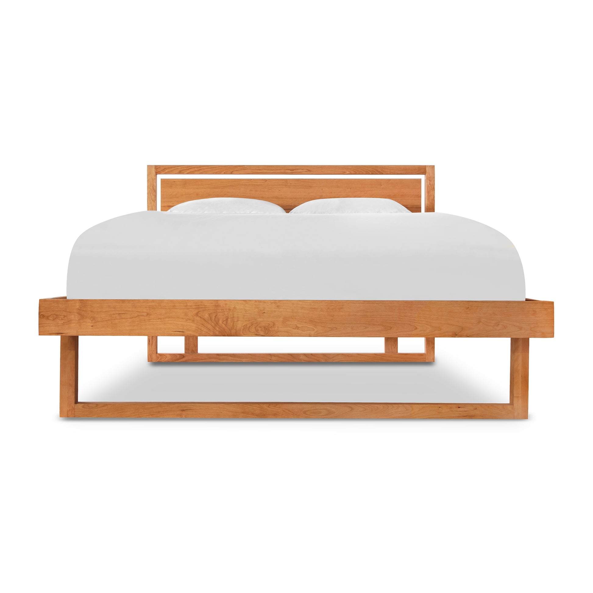A Vermont Furniture Designs Pendant Bed with a wooden frame and white sheets.