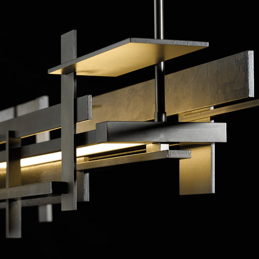 Hubbardton Forge Planar LED Pendant with geometric panels and central light, inspired by Frank Lloyd Wright design.