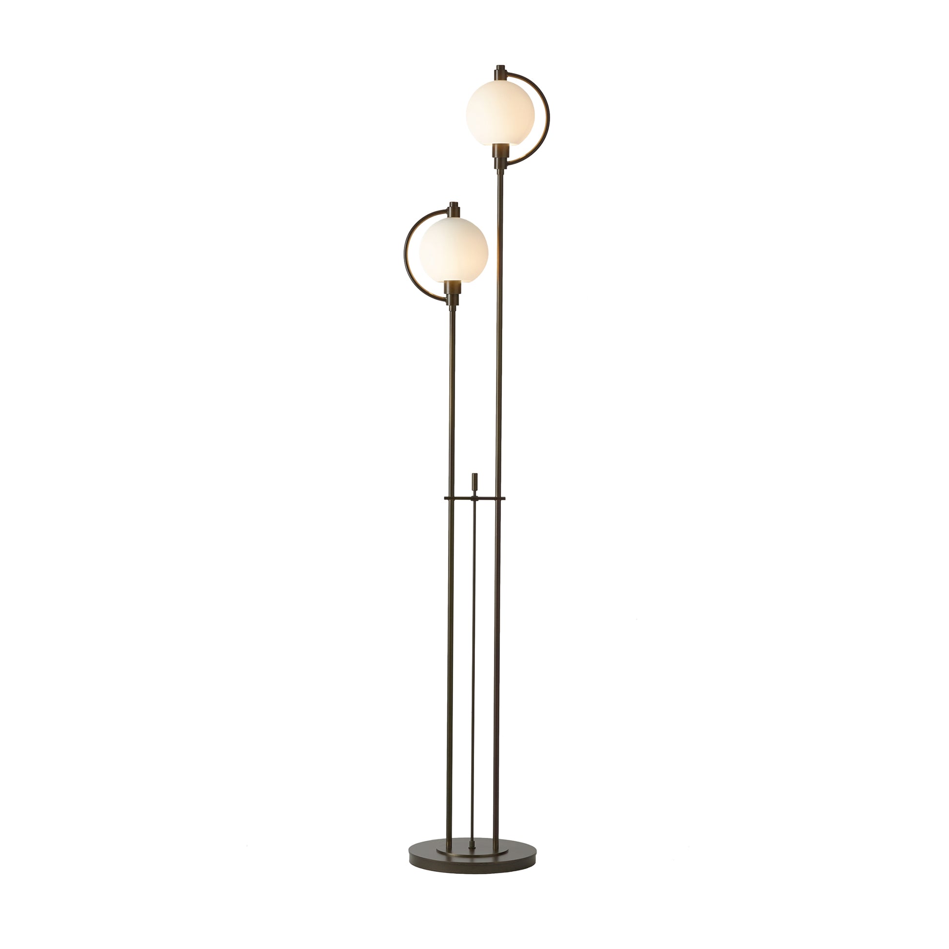 The handcrafted Pluto floor lamp from Hubbardton Forge features two elegant glass globes.