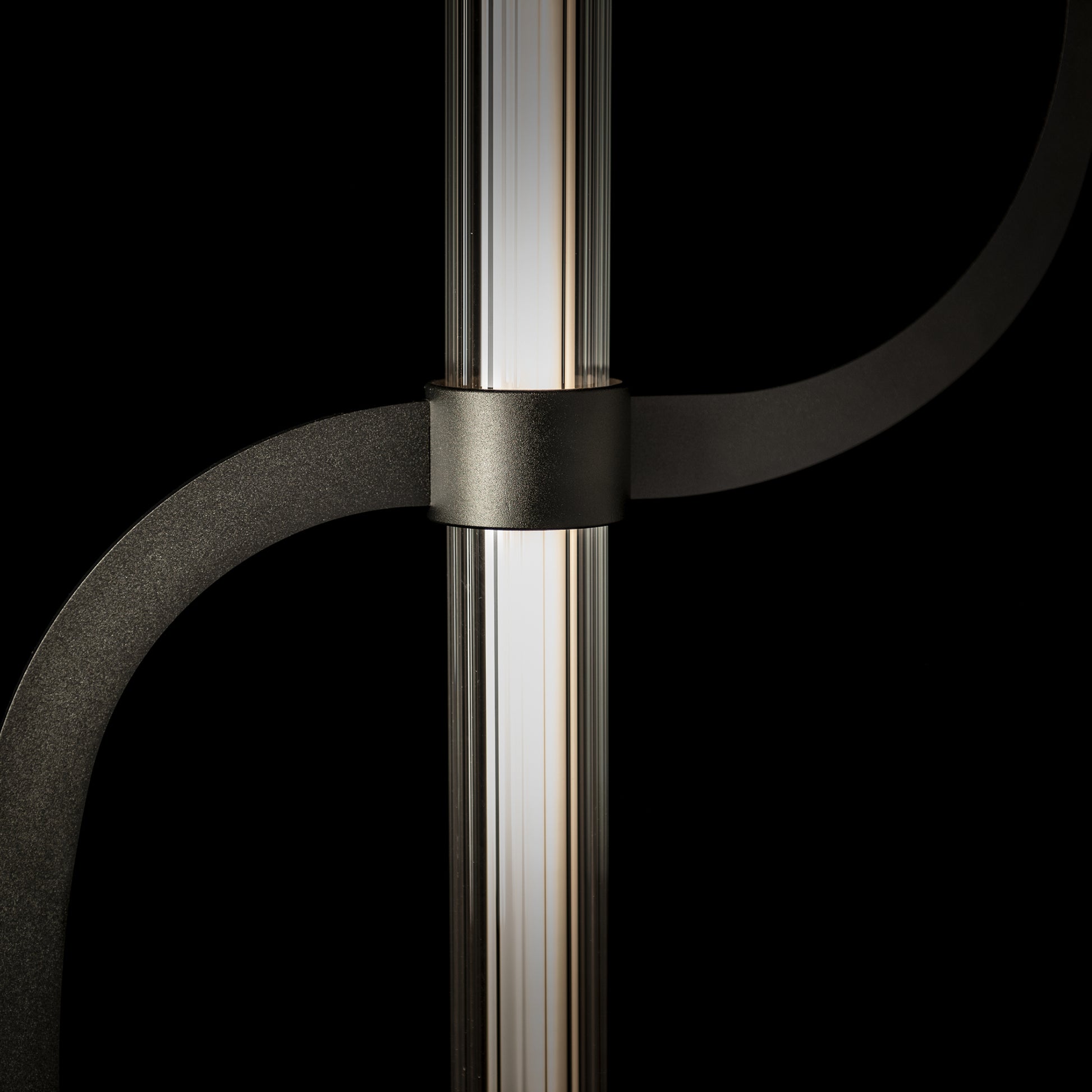 Pulse Floor Lamp by Hubbardton Forge featuring an elegantly curved metal arm and expertly crafted hand-forged steel with vertical light tube.