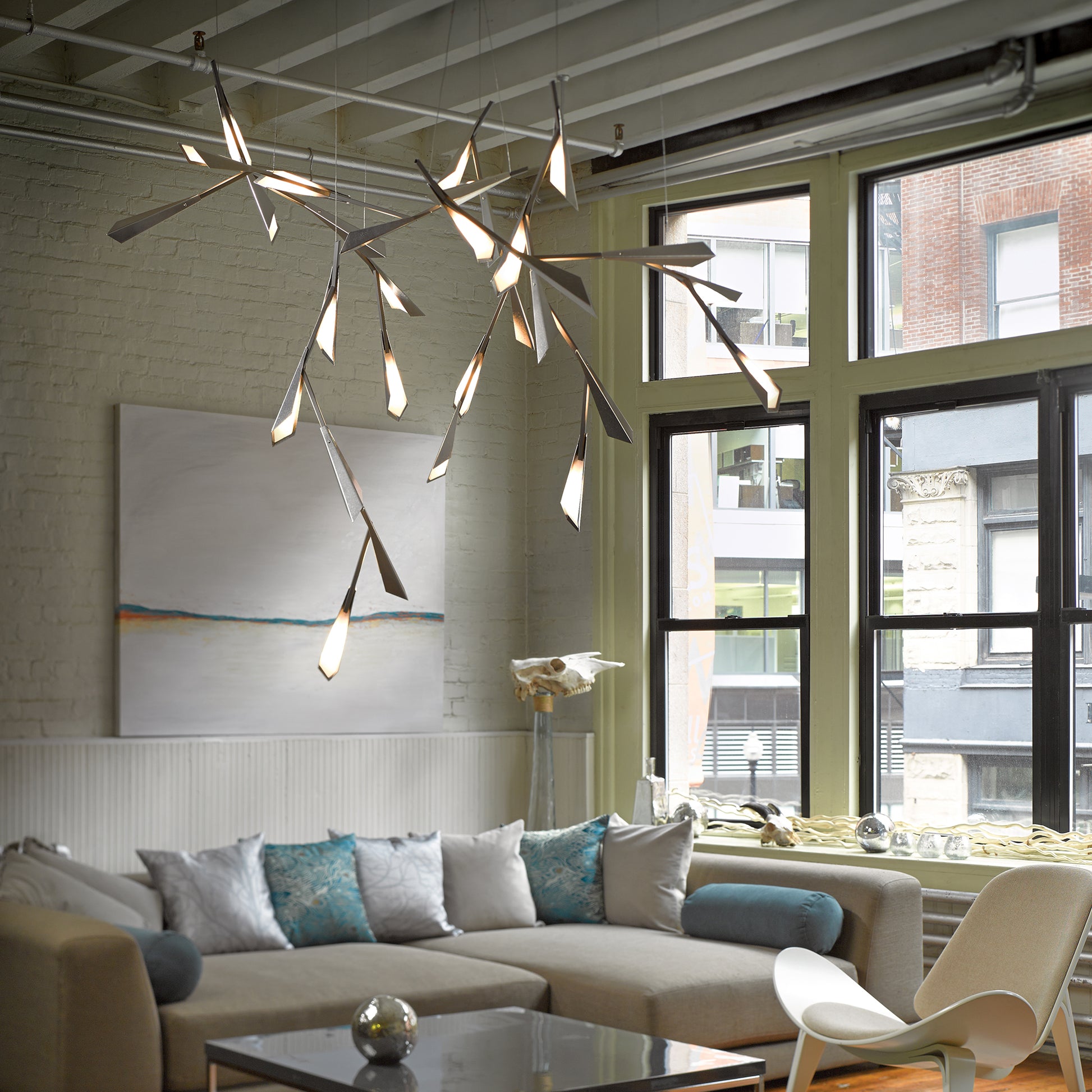 Modern sectional sofa with accent pillows as the centerpiece of a contemporary living room, highlighting its sleek design and craftsmanship.