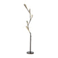 Quill Torchiere Floor Lamp by Hubbardton Forge with three angular LED lights on a sleek black base, showcasing modern handcrafted design.