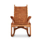 An eco-friendly Quilted Vermont Cherry Rocking Chair by Vermont Folk Rocker, with a woven seat, providing unparalleled comfort.