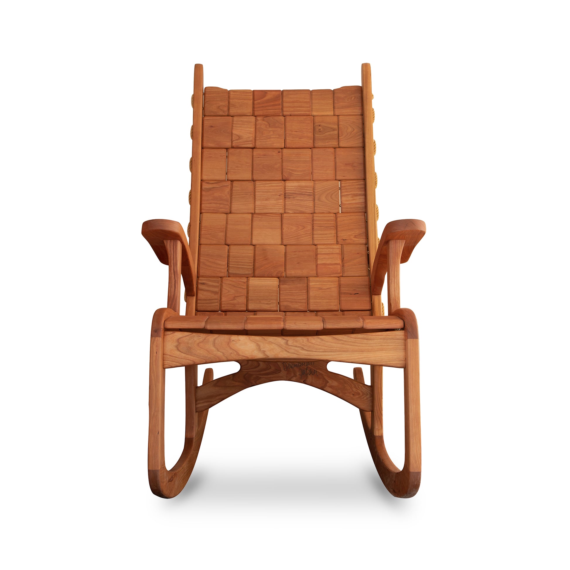 Quilted Vermont Rocking Chair in cherry by Vermont Folk Rocker, featuring a woven backrest and seat with curved armrests and a classic shaker-style design.