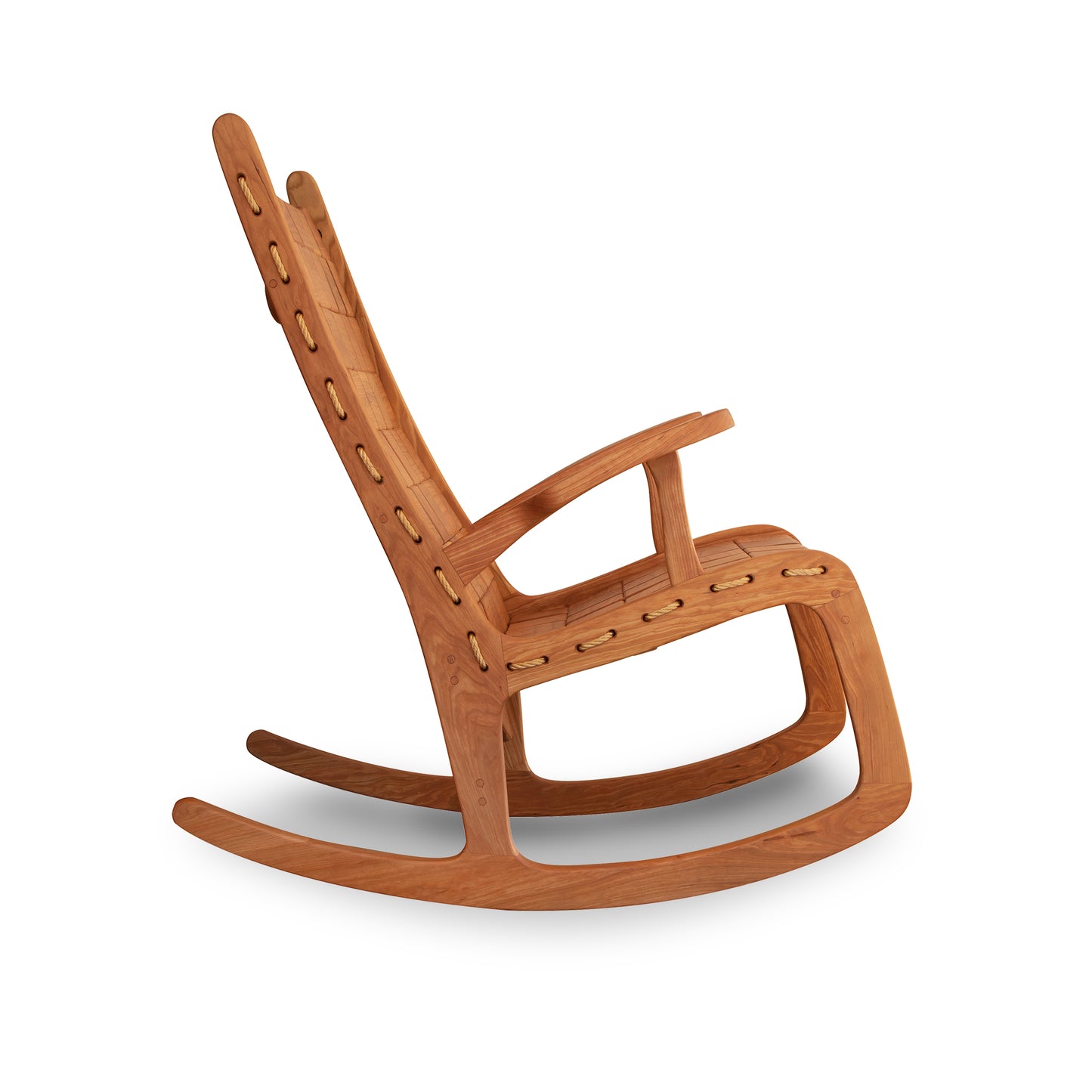 An eco-friendly Quilted Vermont Cherry Rocking Chair from Vermont Folk Rocker, offering superior comfort, showcased against a pristine white background.