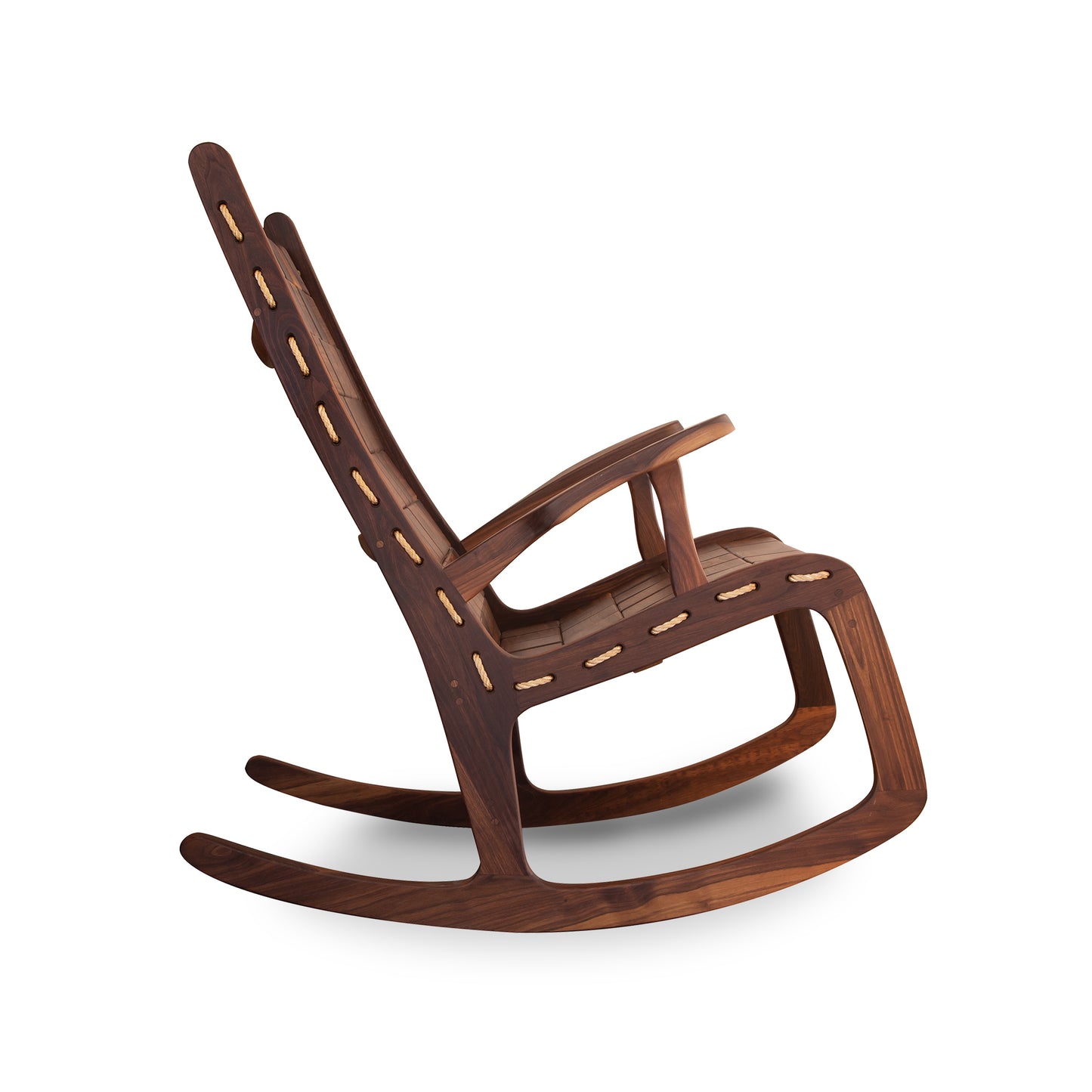 A Quilted Vermont Walnut Rocking Chair with a sleek, modern design, featuring lighter wood inlay details on the dark brown slats, in the shaker style, isolated on a white background by Vermont Folk Rocker.