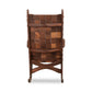 Vermont Folk Rocker Quilted Vermont Walnut rocking chair with woven backrest and crossbar, showcasing elegant craftsmanship and design.