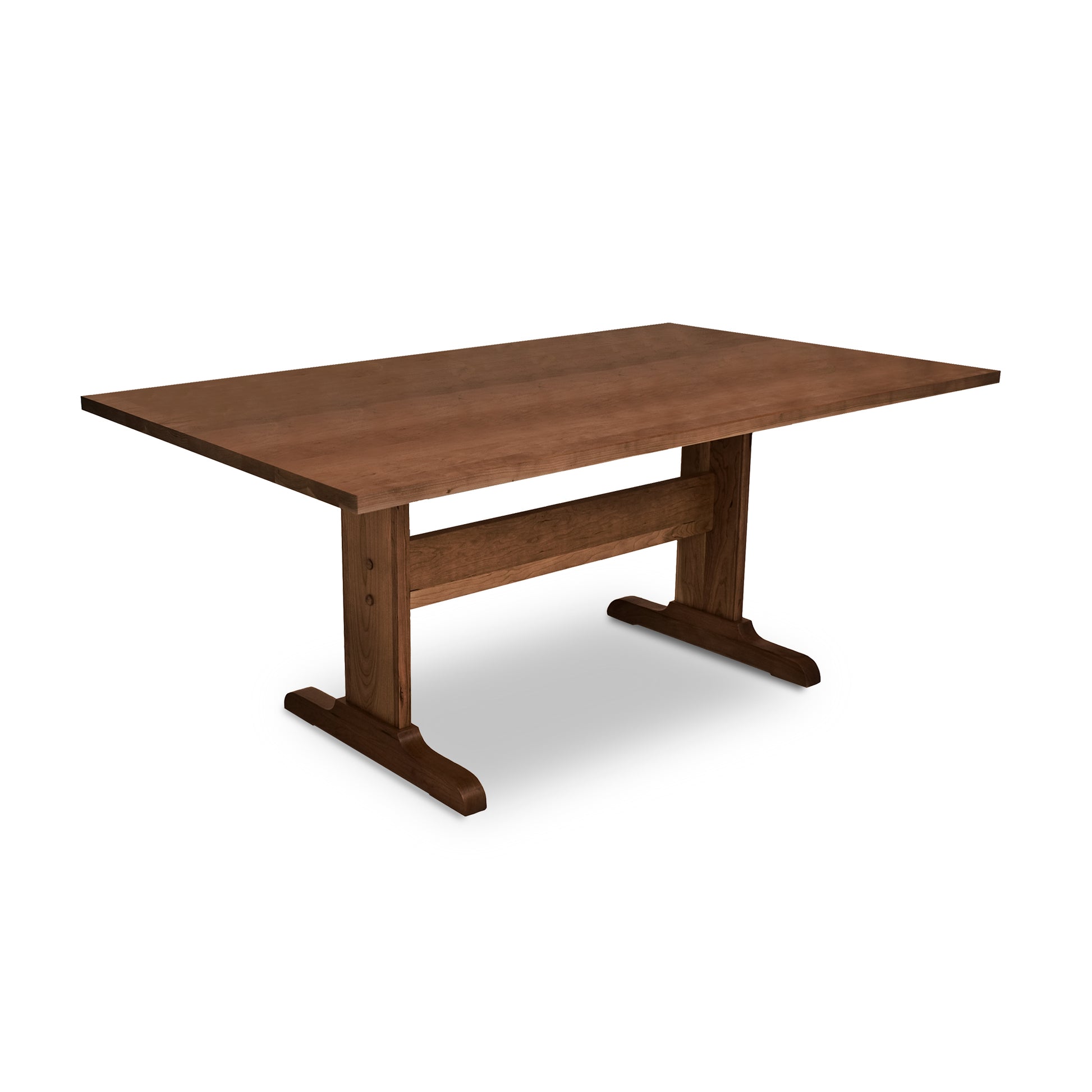 An eco-friendly Rectangular Trestle Solid Top Table by Lyndon Furniture with sustainably harvested woods and two legs on a white background.