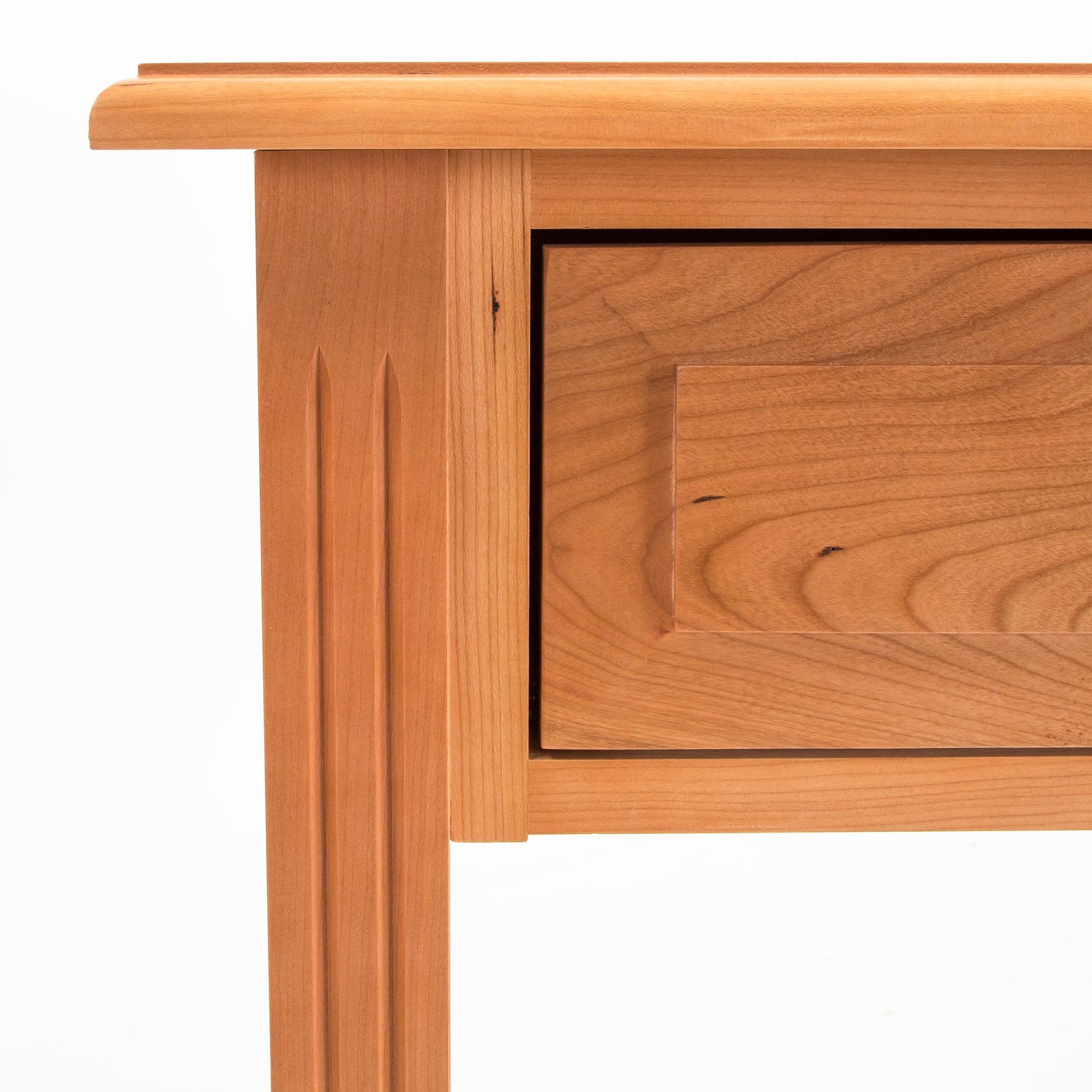 A close-up of a Lyndon Furniture Renfrew Shaker 1-Drawer Open Shelf Nightstand with a drawer made from solid hardwoods.