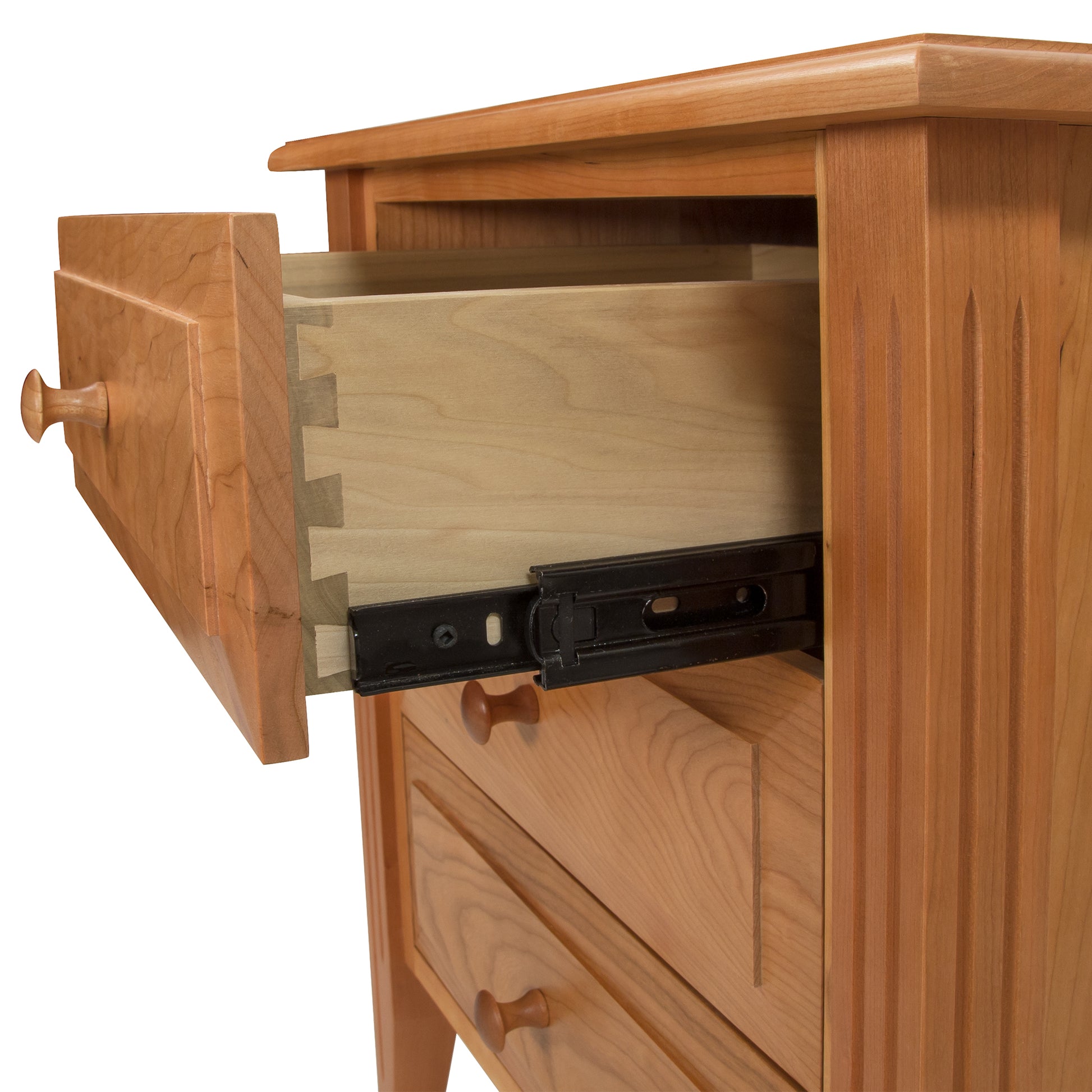 A Renfrew Shaker 3-Drawer Nightstand by Lyndon Furniture with an open drawer.
