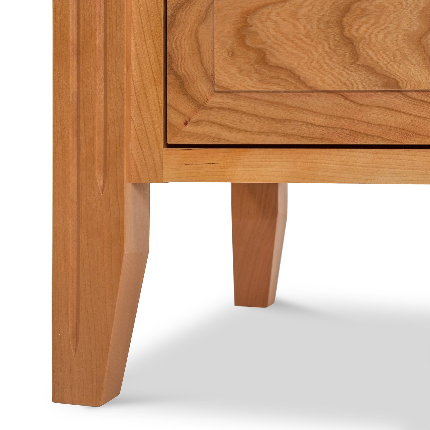 A close up of a Renfrew Shaker 3-Drawer Nightstand by Lyndon Furniture.
