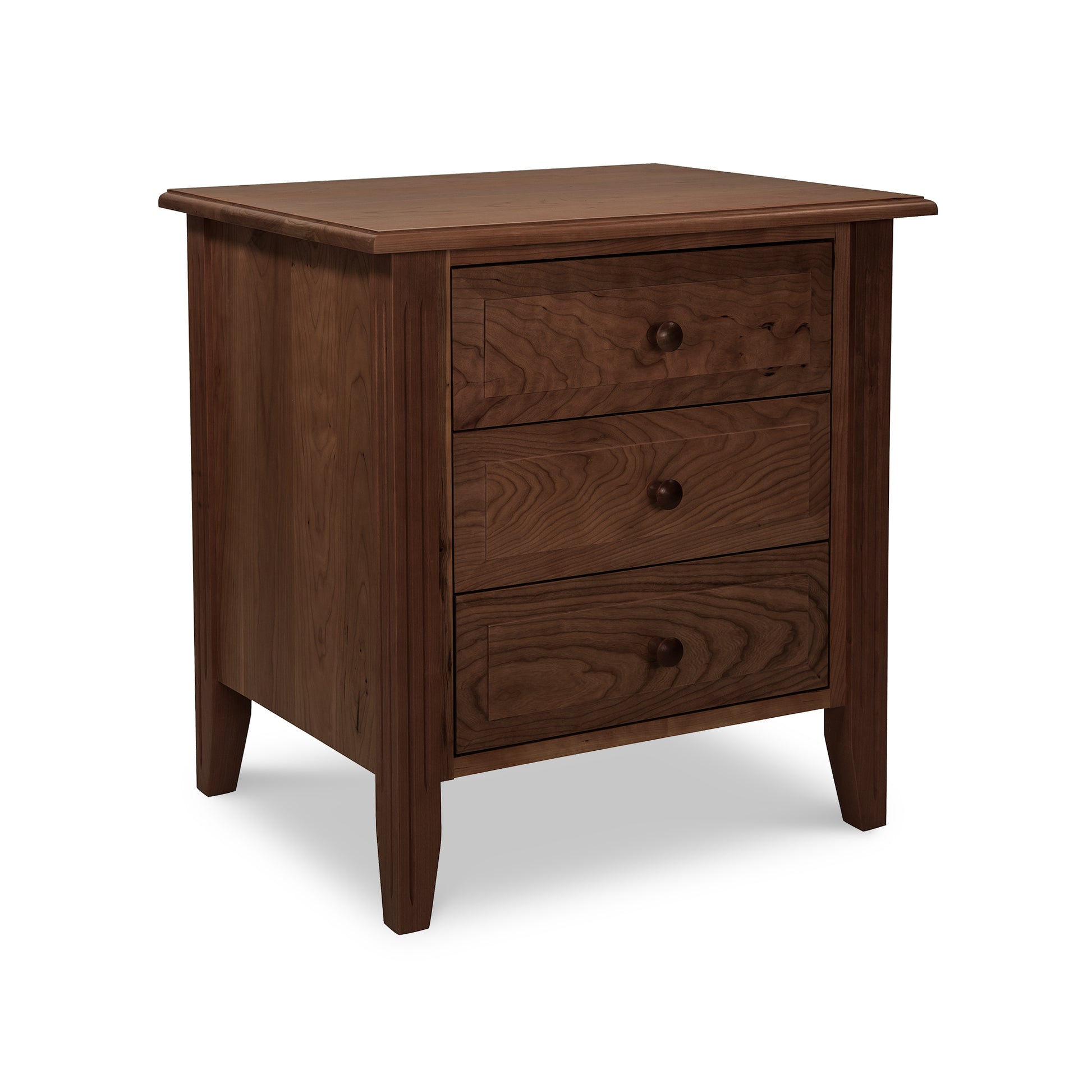 A Renfrew Shaker 3-Drawer Nightstand by Lyndon Furniture with fluted legs on a white background.
