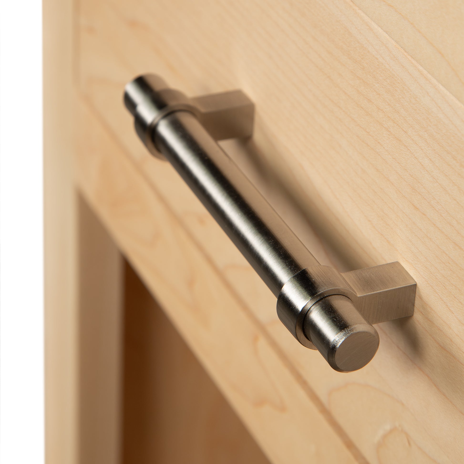Detail of the brushed metal handle on the Rockingham 1-Drawer Nightstand by Vermont Woods Studios, highlighting fine American craftsmanship.