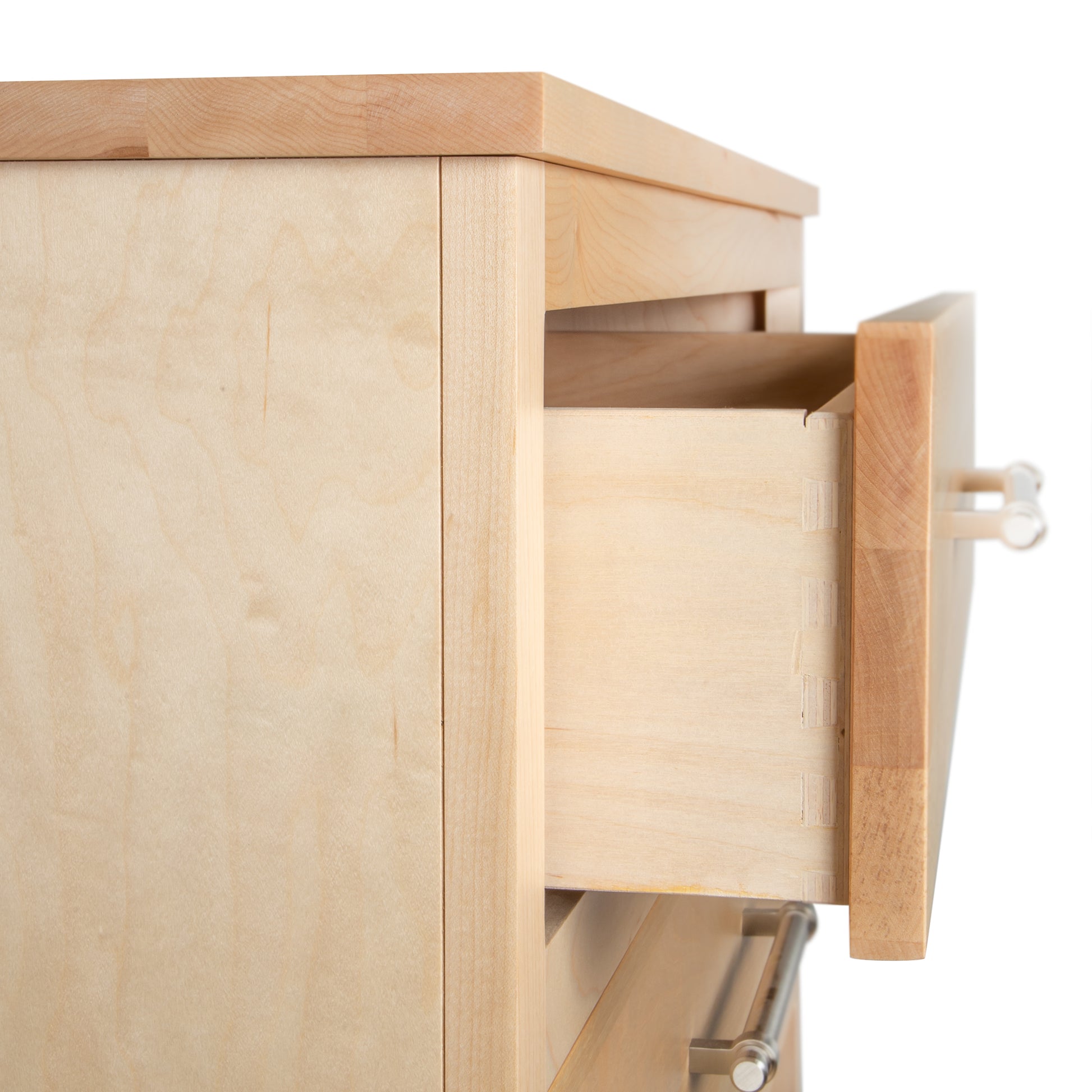Rockingham 5-Drawer Chest by Vermont Woods Studios in close-up, featuring expert dovetail joints and sleek metal handles, showcasing quality craftsmanship.