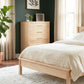 Vermont Woods Studios Rockingham 5-Drawer Chest in light wood, showcased alongside matching light wood bedroom furniture.