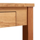 Close-up of the Maple Corner Woodworks Ryegate Writing Desk, showcasing the texture and joinery of the light-colored solid wood construction.