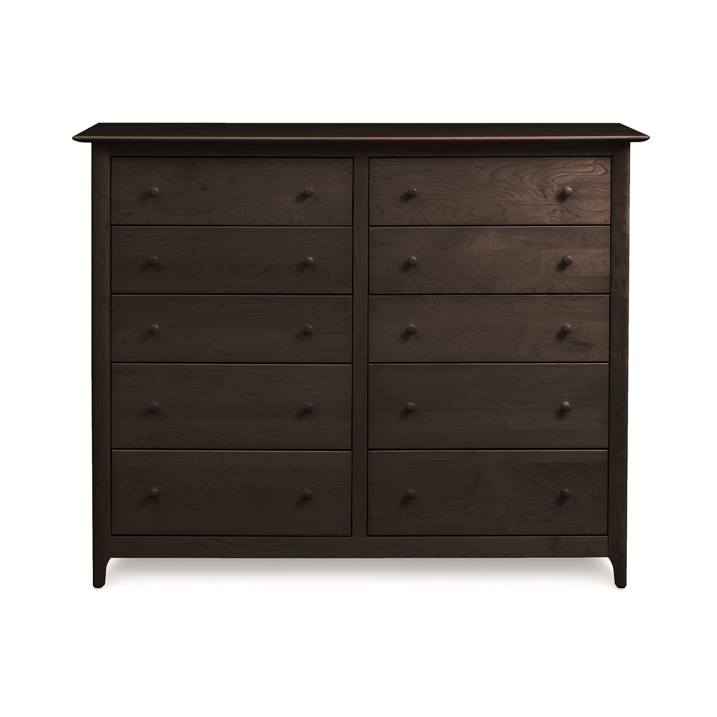 Response: A dark, eco-friendly Sarah 10-Drawer Dresser by Copeland Furniture, featuring three drawers on the left side and three slightly smaller drawers on the right side, all with round knobs, against a plain white background.