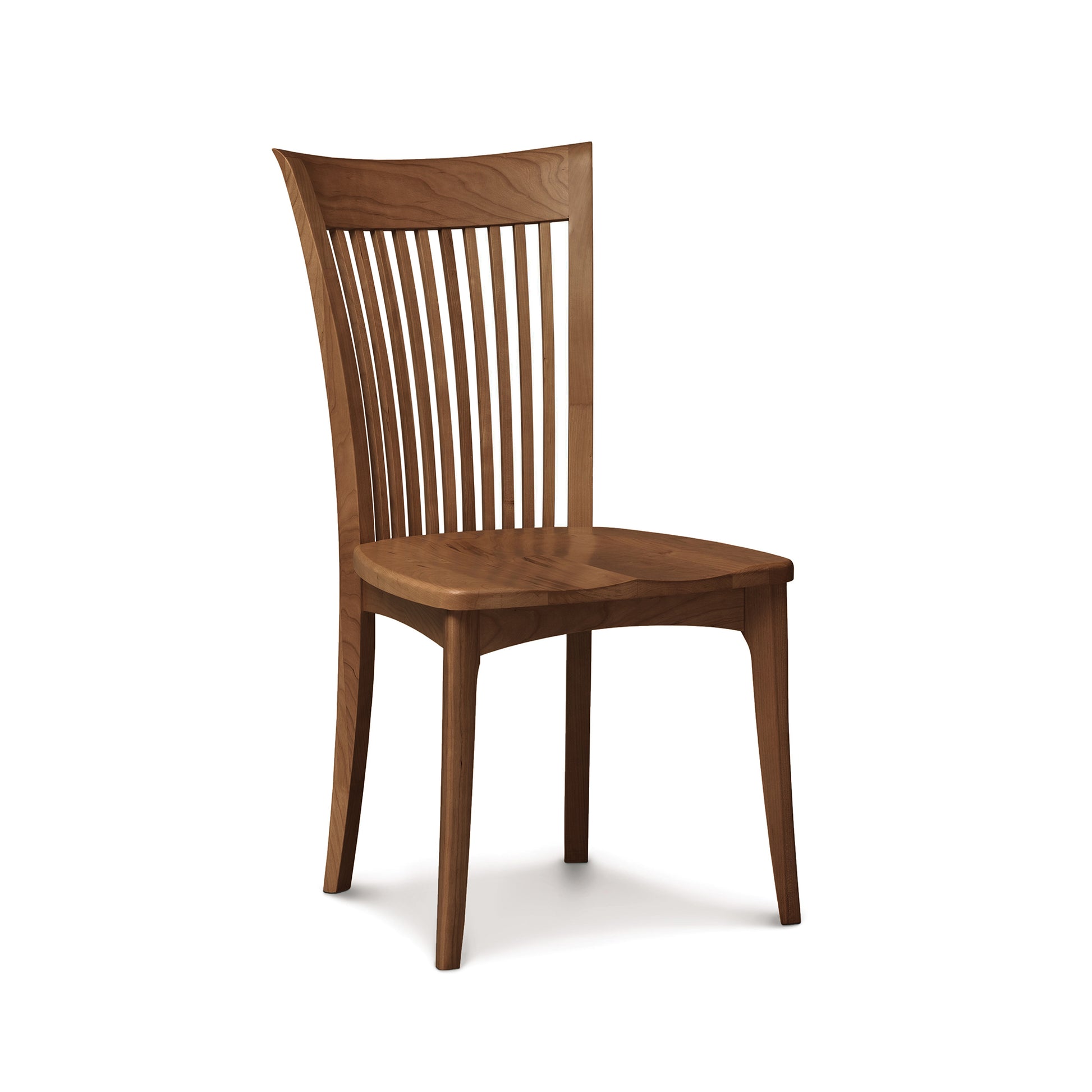 Sarah Shaker Chair by Copeland Furniture, crafted from American cherry wood with a curved slatted back and four sturdy legs, shown in high-quality detail.