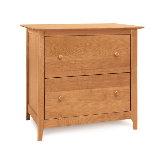 A wooden chest of drawers with two drawers.