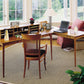 Copeland Furniture Sarah Large Desk in natural wood finish, featuring clean lines and ample workspace, shown with laptop and lamp on top.