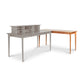 Copeland Furniture Sarah Return with Keyboard Tray in light brown seamlessly connects to a gray Shaker desk with hutch, forming an elegant workstation.
