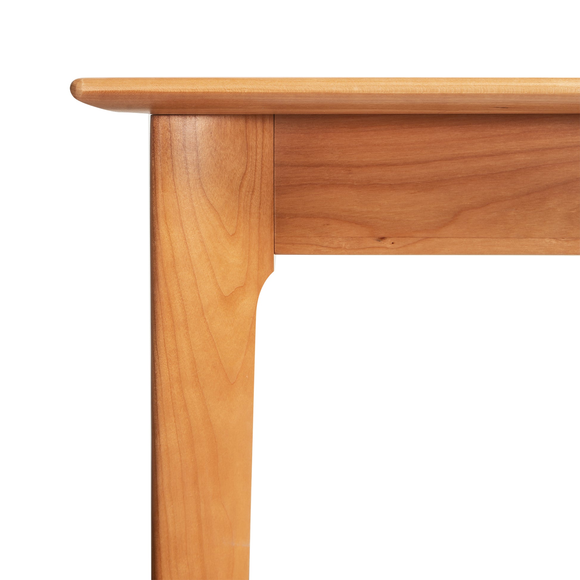 Detailed view of the Sarah Return with Keyboard Tray by Copeland Furniture, highlighting the elegant leg and tabletop craftsmanship.